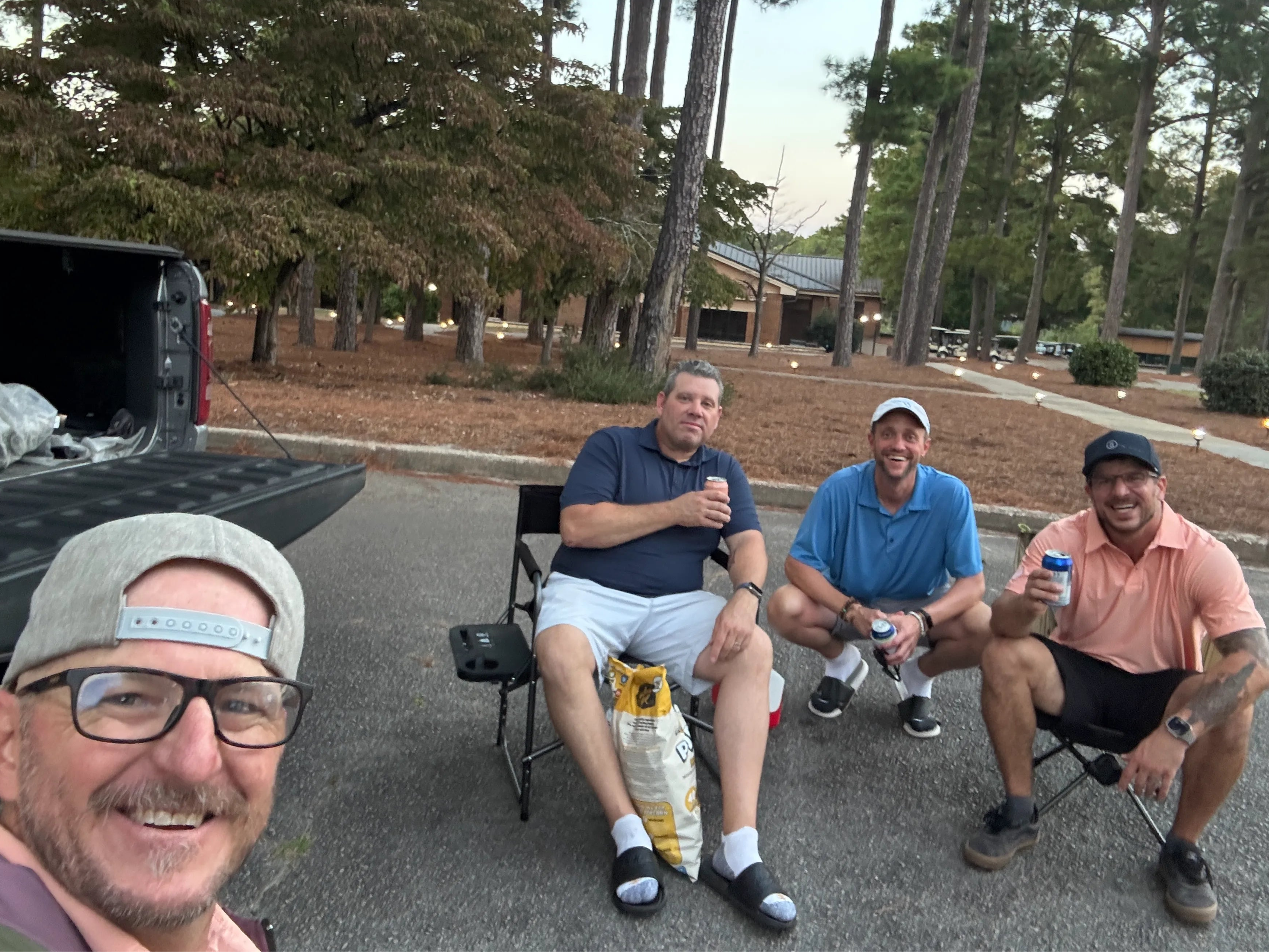 Men sitting in camp chairs after a round—honest post-round circle, Golf Ball Wisdom community.